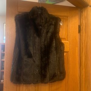 Faux fur vest. Size not marked. Would fit a small best. Like new